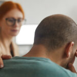 Person learning about substance abuse counseling warning signs and recovery support