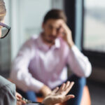 Person speaking with counselor during substance use disorder treatment session