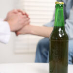 Person learning about Alcohol Addiction Recovery and behavioral therapy treatment options