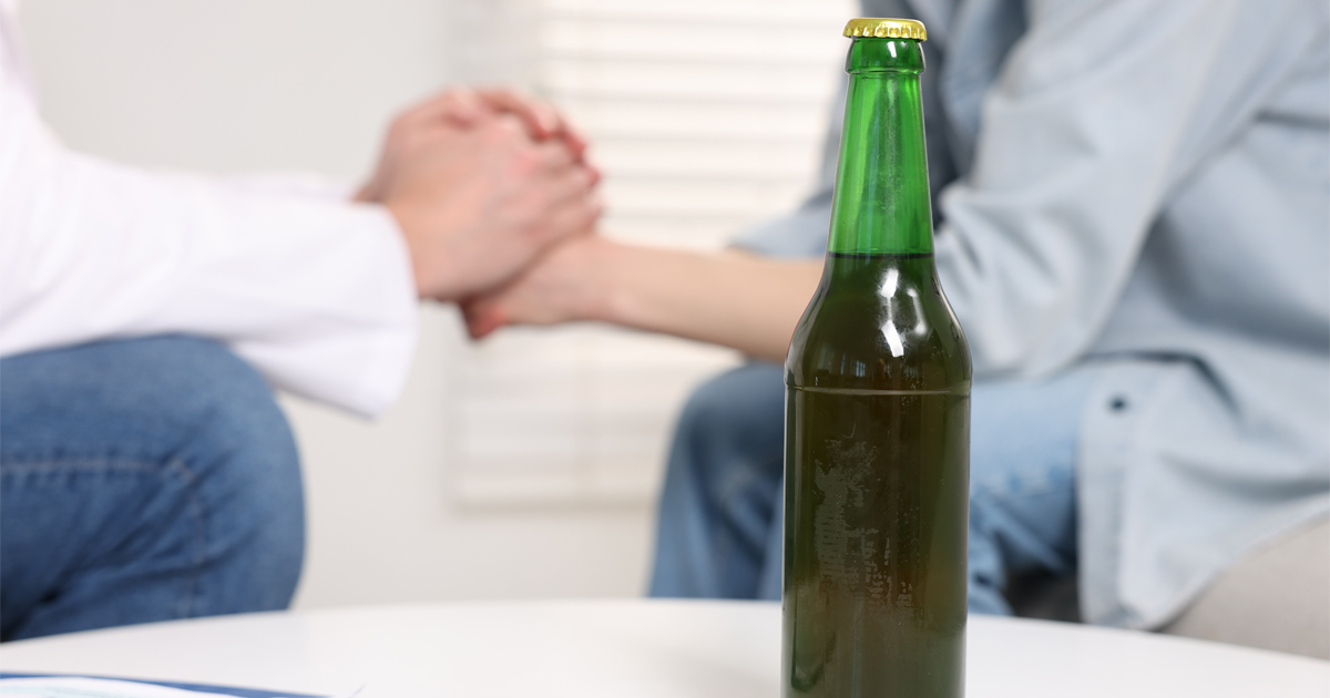Person learning about Alcohol Addiction Recovery and behavioral therapy treatment options
